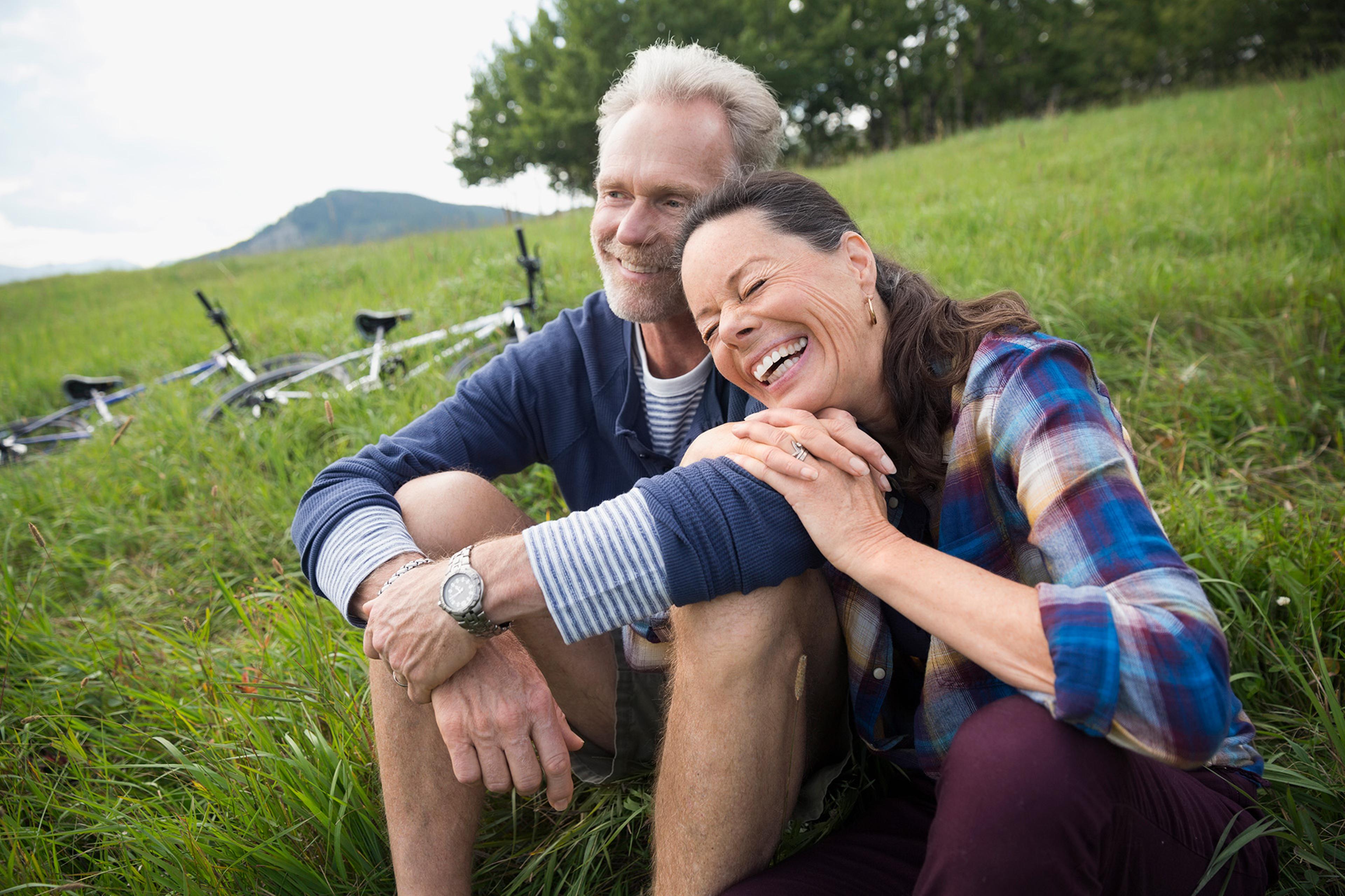 Couple sitting in the grass.