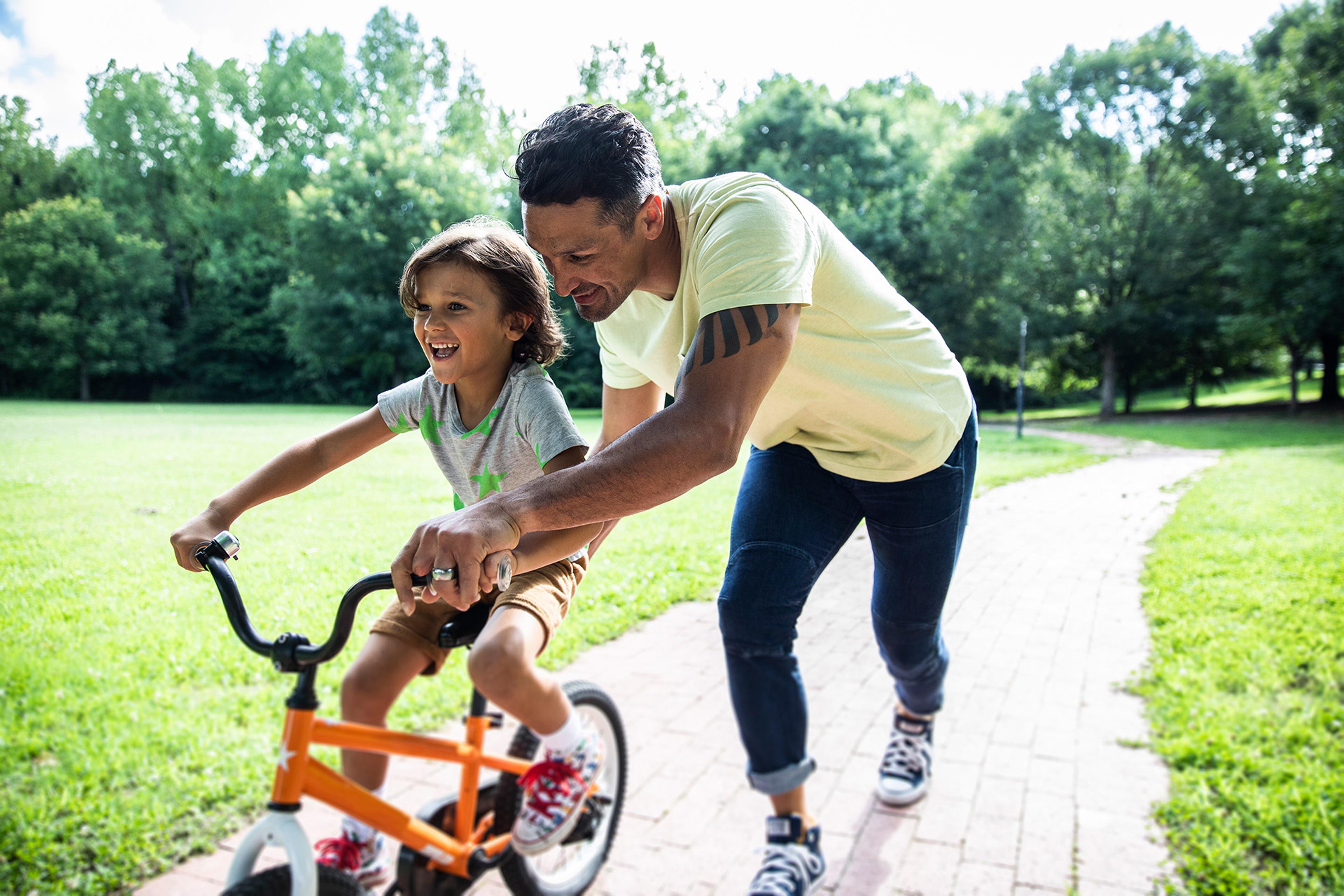 Child learning to ride bike.